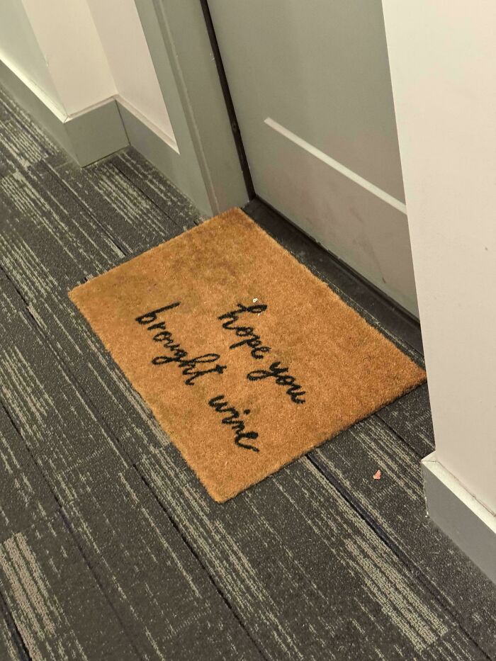 Doormat reading hope you brought wine awkward placement design fail