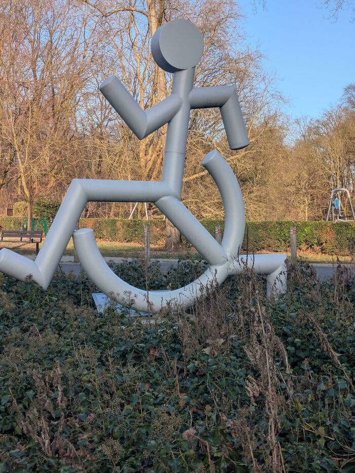 Large wheelchair symbol sculpture in park showing design fail