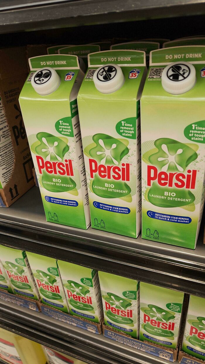 Persil laundry detergent cartons with confusing do not drink labels on cartons at store shelf