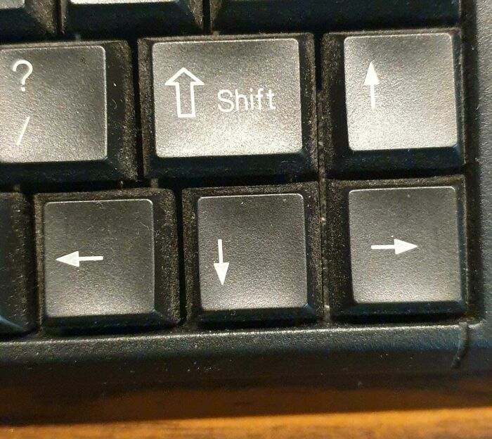 Keyboard arrow keys with inconsistent directions and a shift key design fail