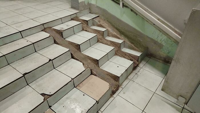 Irregular tile stairs with unusual riser and tread design fail
