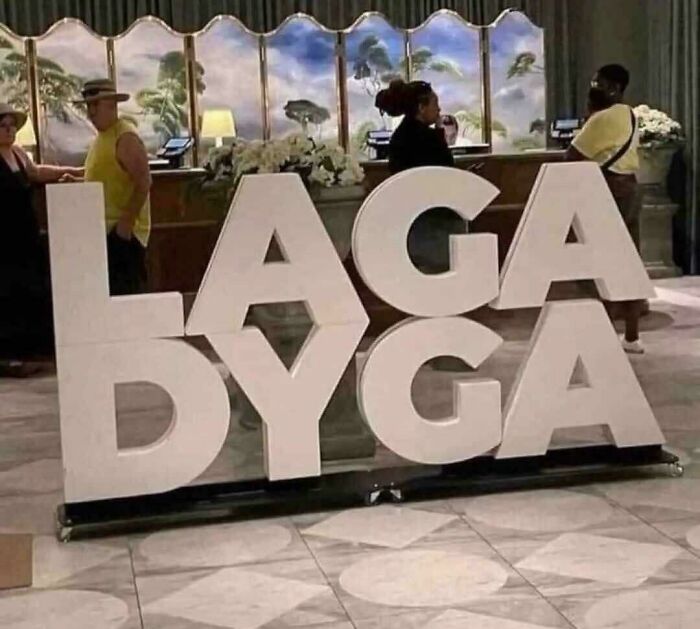 Large hotel sign with letters arranged to create unreadable text design fail