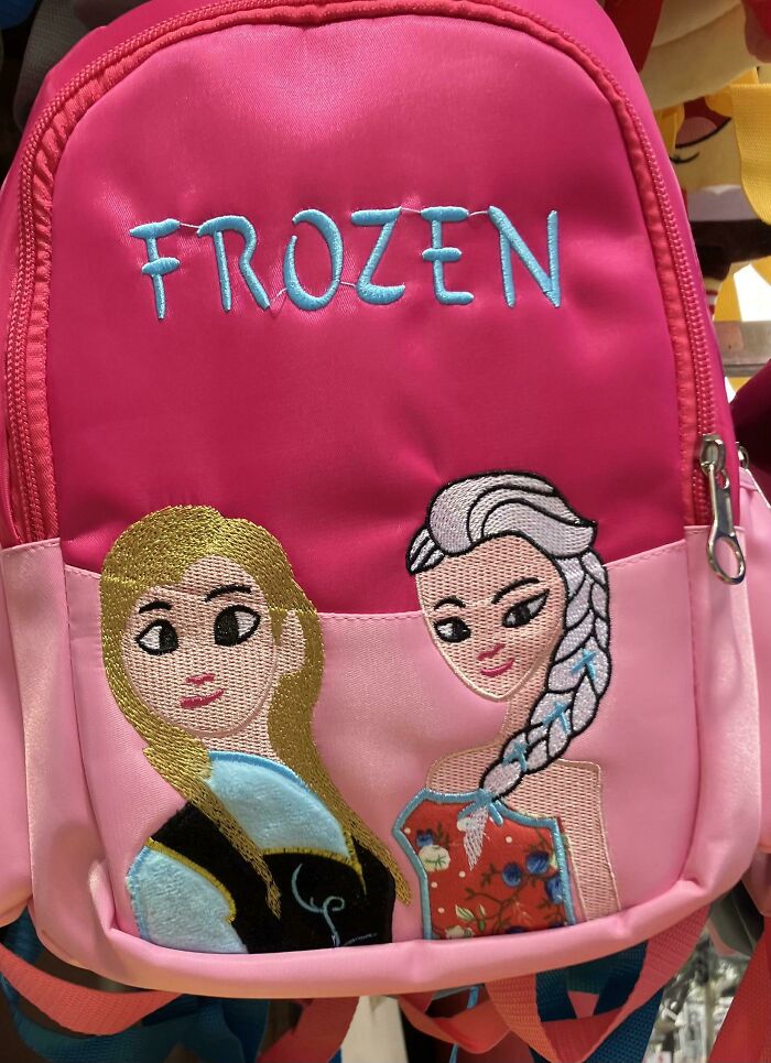Pink backpack with poorly embroidered Frozen characters showing design fail