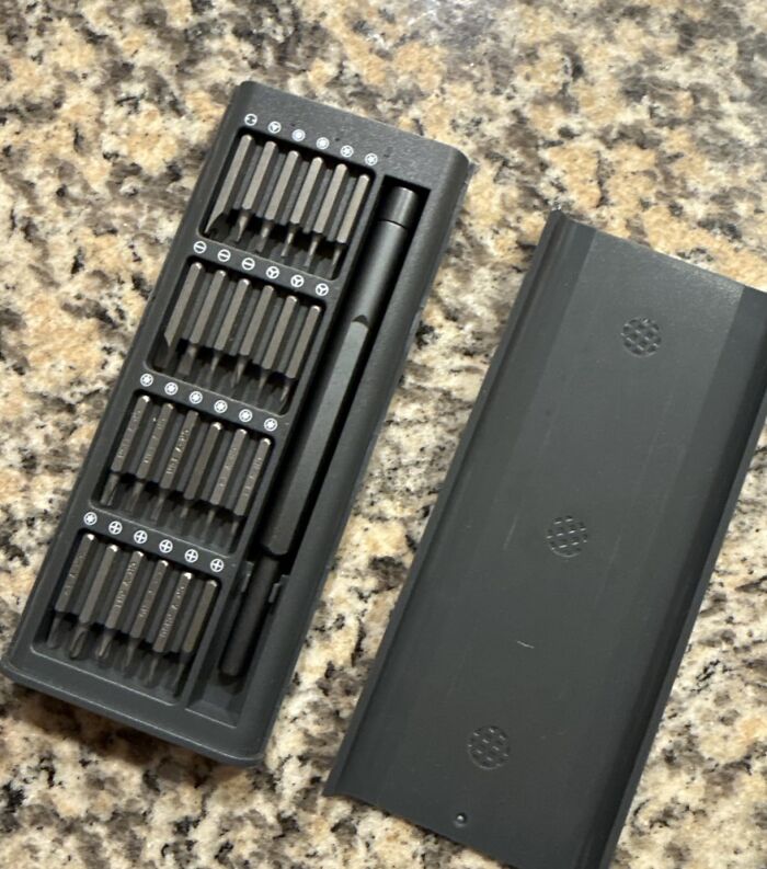 Compact precision screwdriver set with various bits on granite countertop Father's Day gifts