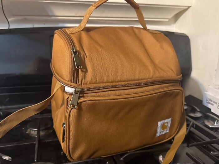 Brown insulated cooler bag with zipper compartments on stove top Father's Day gifts