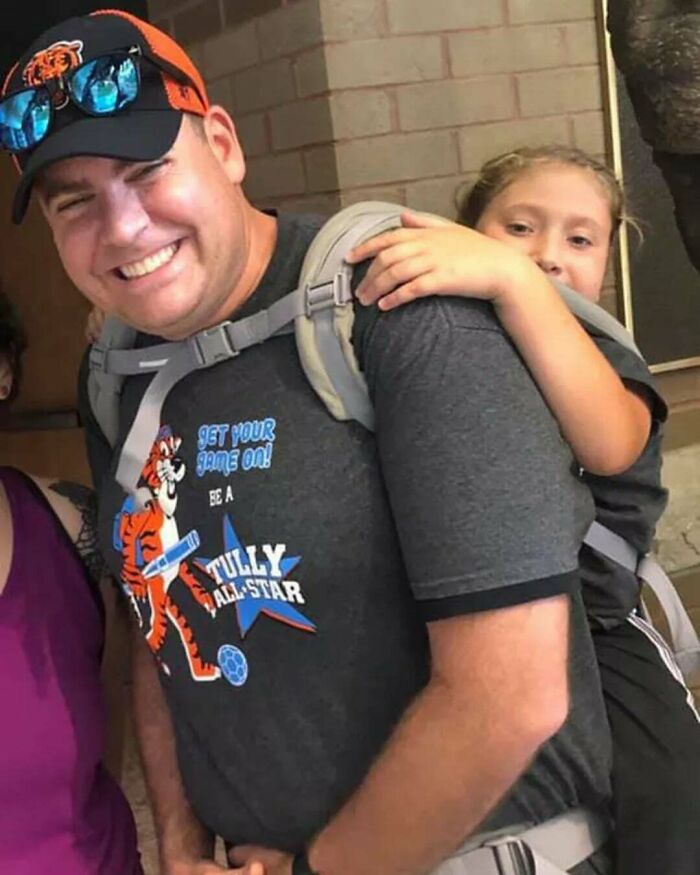 Uplifting posts: A smiling father gives his daughter a piggyback ride, celebrating a moment of joy.