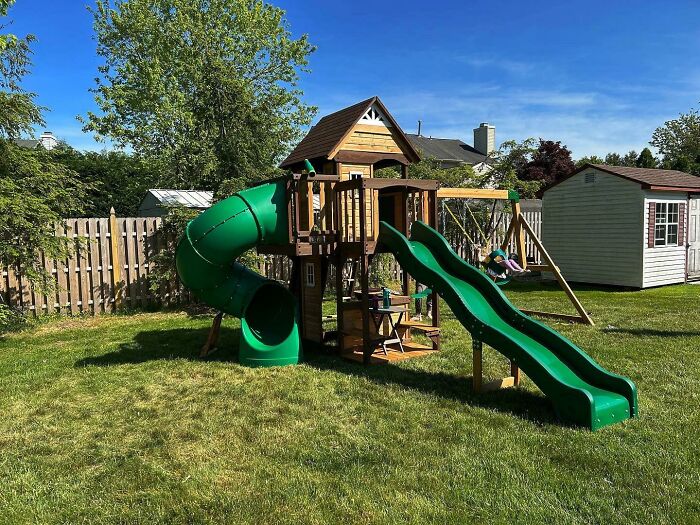 A wonderful playset in a backyard, showing the joy amazing fathers create for their children.