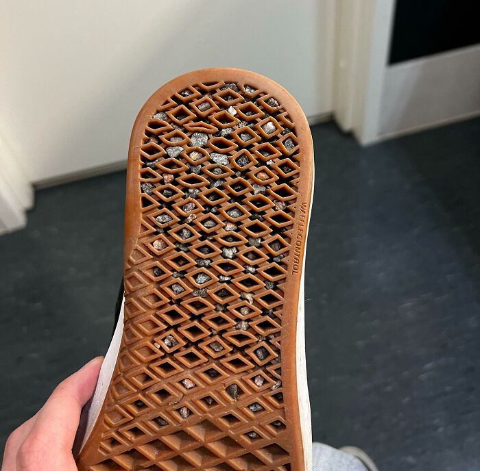 Shoe sole filled with stones stuck in tread pattern design fail