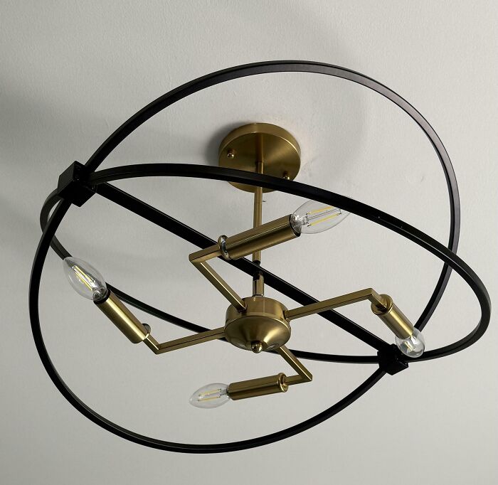 Ceiling light fixture with awkward intersecting rings design fail