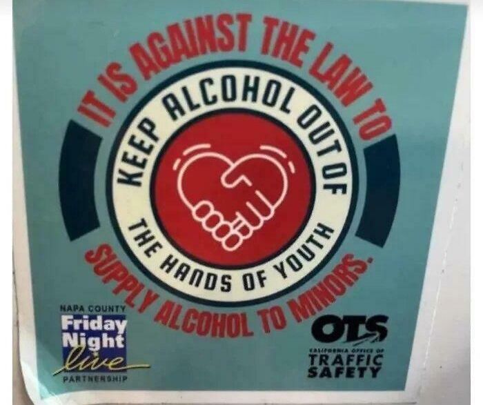 Sign with poorly worded message about keeping alcohol away from youth causing confusion