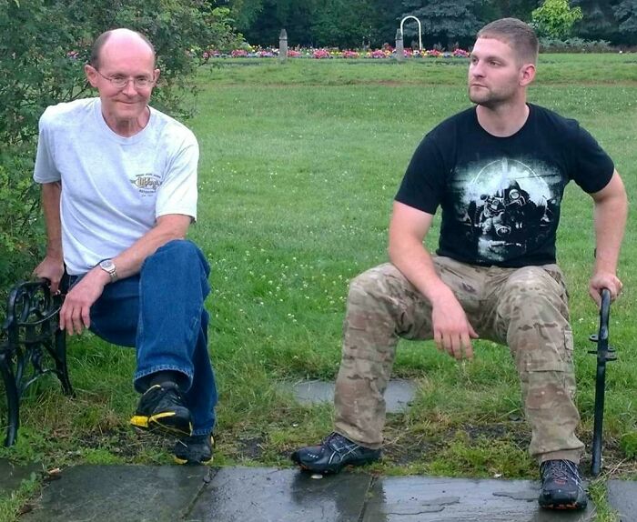 Two amazing fathers sit on an invisible bench, highlighting creative moments of parents and dads.