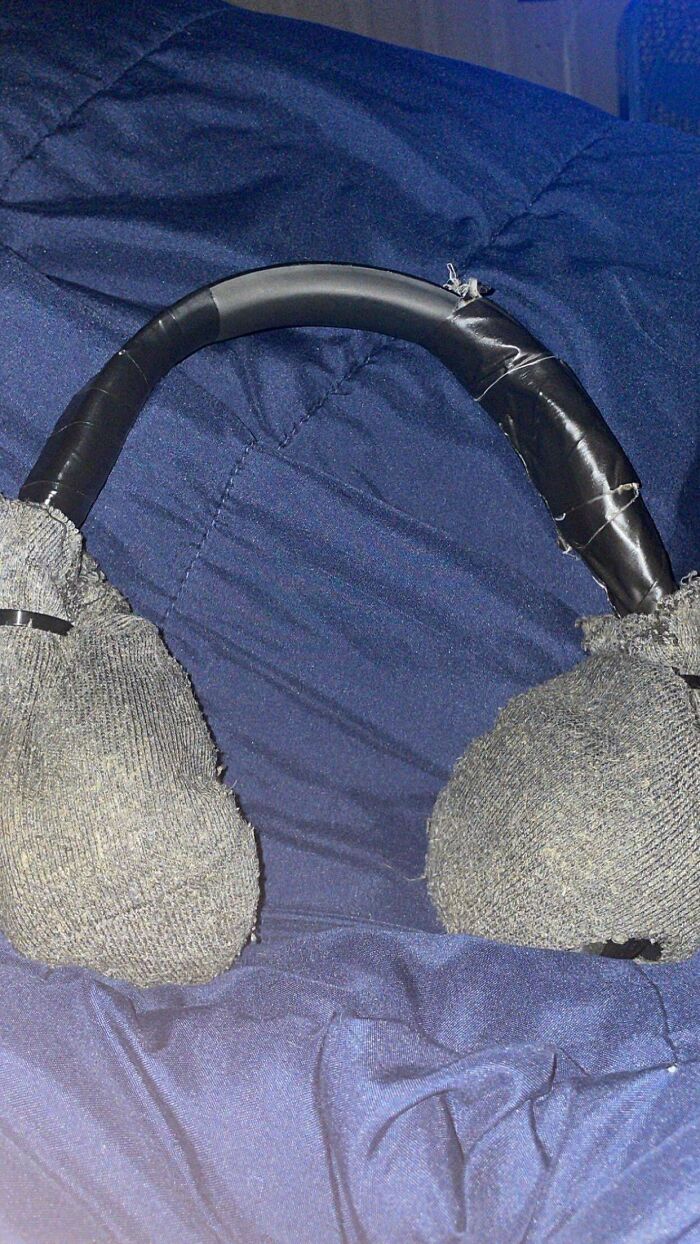 Homemade earmuffs crafted from socks and electrical tape, showing clever solutions with random junk.