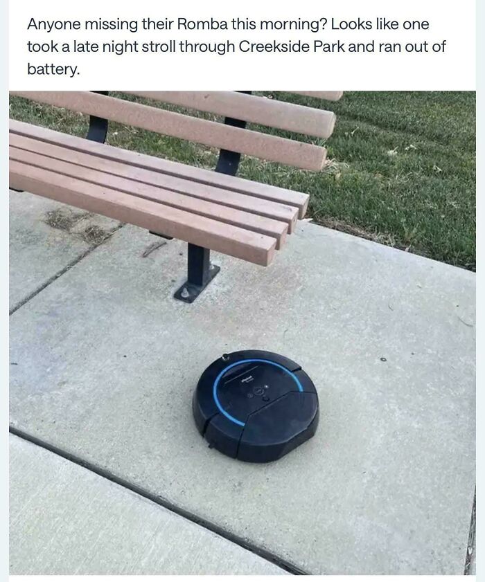 Hilarious screenshot of a lost Roomba robot vacuum next to a park bench in a neighborhood online community.
