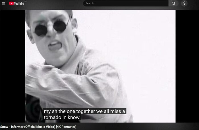 Funny internet moment in a YouTube screenshot of the music video Snow - Informer with nonsensical closed captions.