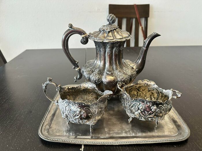 Ornate silver tea set on a matching tray, an old treasure discovered by antique lovers