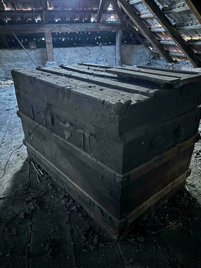 Large weathered wooden trunk, one of many old treasures discovered in an attic.