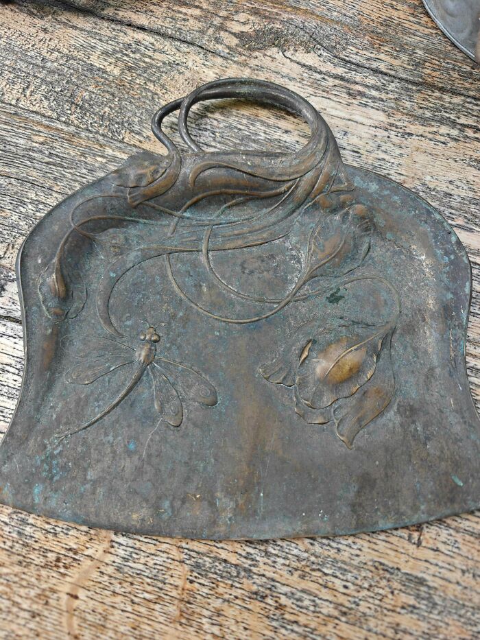 Art Nouveau metallic tray with dragonfly design found by antique lovers.