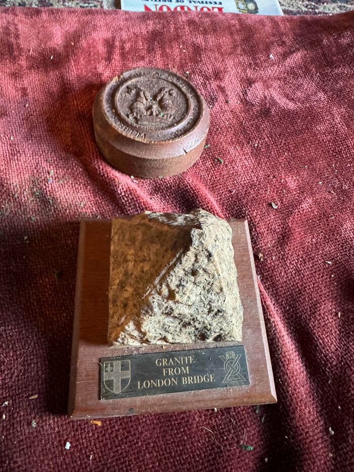 Granite souvenir from London Bridge and an old wooden seal displayed as old treasures