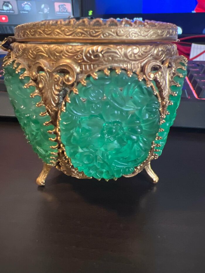 Ornate antique box with green glass panels, a unique discovery among old treasures