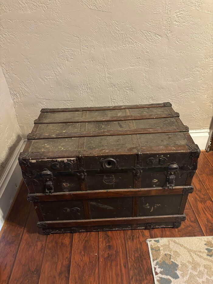 Large vintage wooden trunk with metal latches, a classic piece among old treasures for antique lovers.