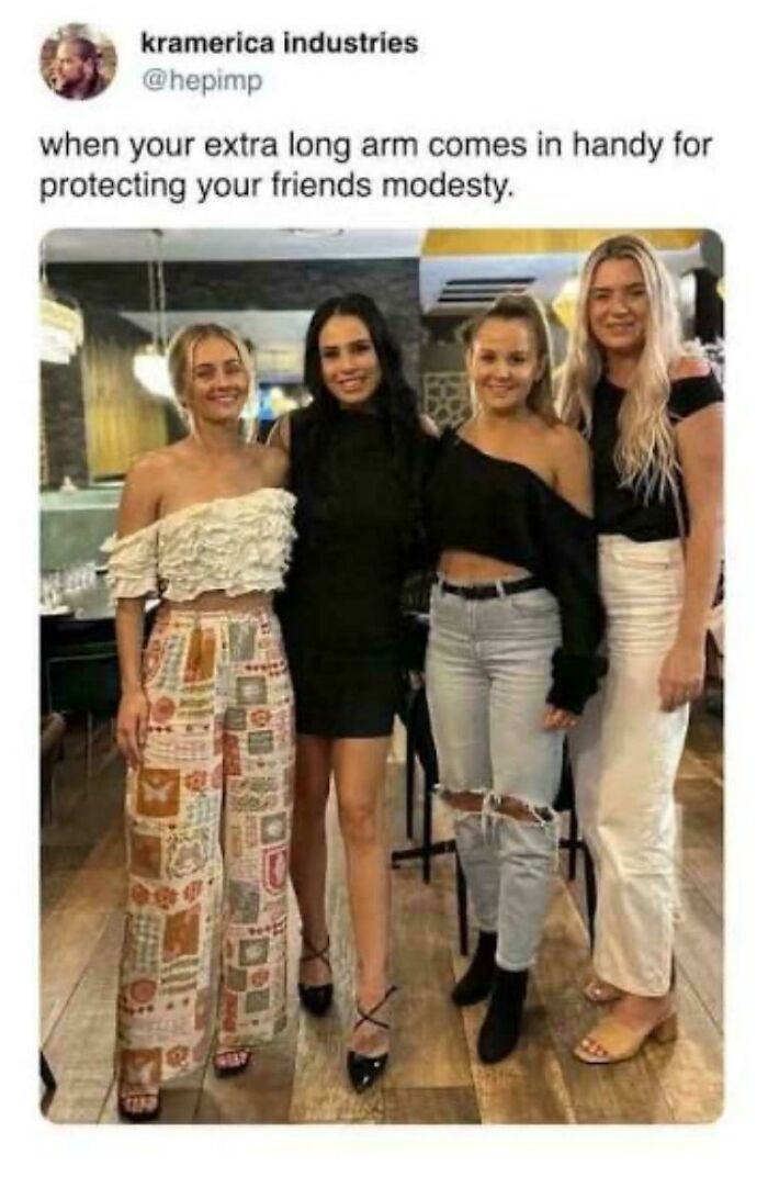 A group of four women, where one woman's arm creates an optical illusion, looking like a glitch in the matrix.