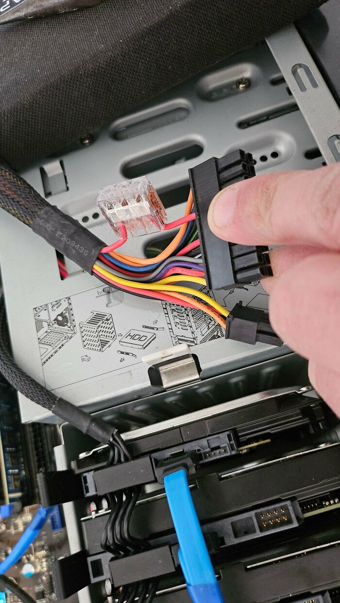 Questionable DIY projects show a computer power connector modified with a plastic lever nut terminal block.