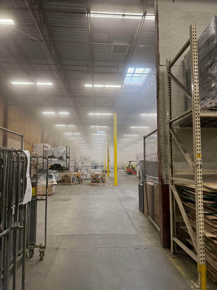 A dusty warehouse aisle showing the working environment of Home Depot employees