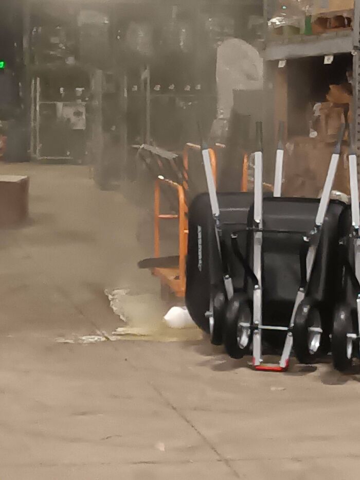 Several wheelbarrows stacked on a dusty floor relating to Home Depot employees posts.