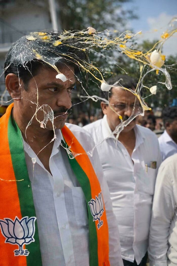 A man with an egg splattered on his head and clothes, one of the peculiar things people spotted in real life.