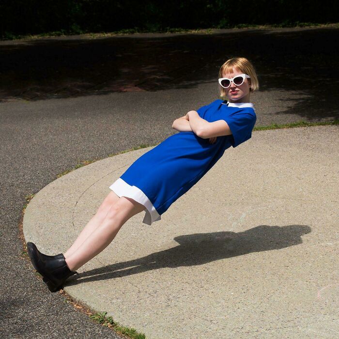 A woman leaning at an impossible angle in a blue dress, one of the peculiar things people spotted in real life.