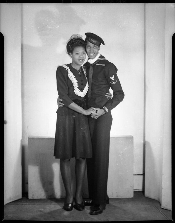 Historical photos of a smiling US Navy sailor embracing a young woman.