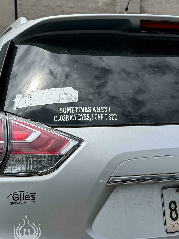 Funny bumper sticker on a white car reads, Sometimes when I close my eyes, I can't see.