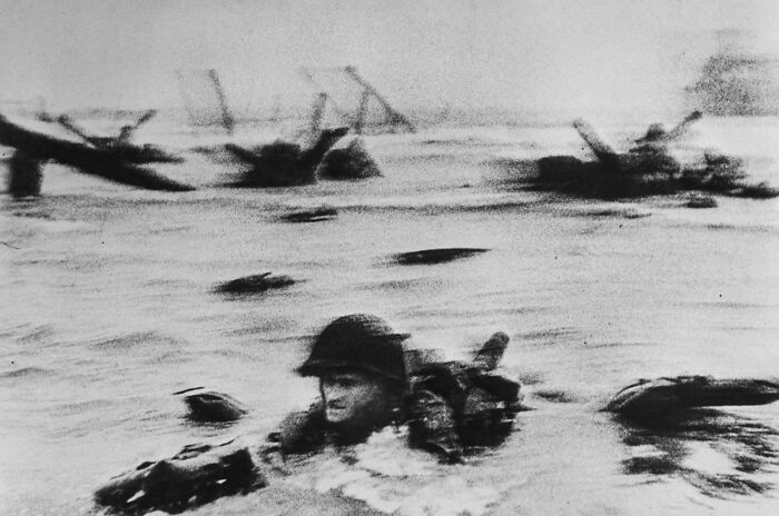 Vintage black and white photo of soldier swimming during wartime