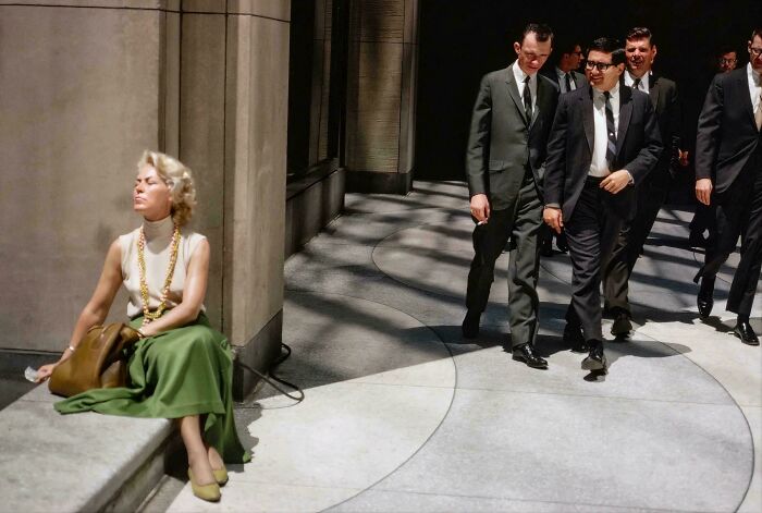1960s men in suits walking in city street