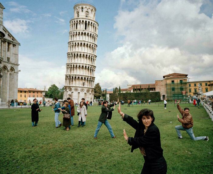 Tourists posing with Leaning Tower of Pisa in charming travel photo
