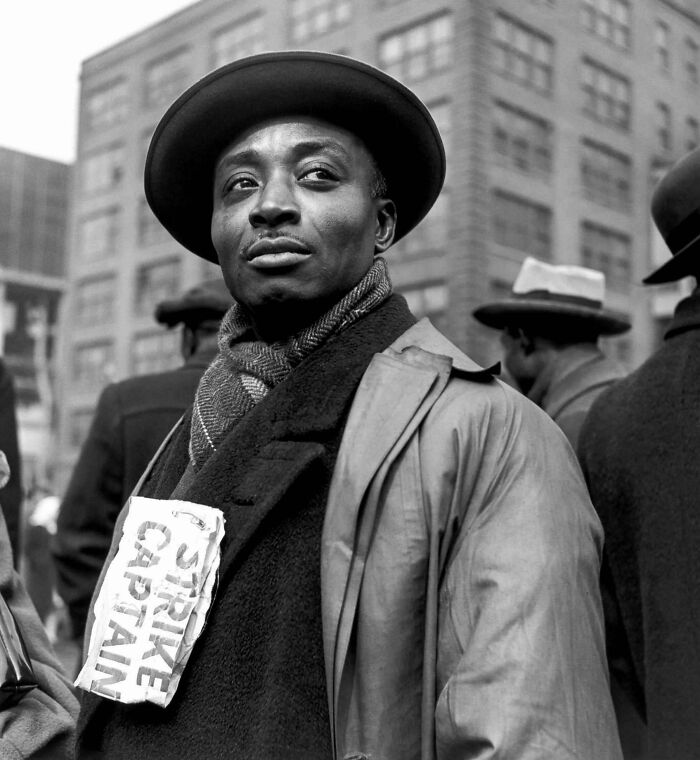 Historic portrait of man wearing strike captain sign during labor strike in past decades