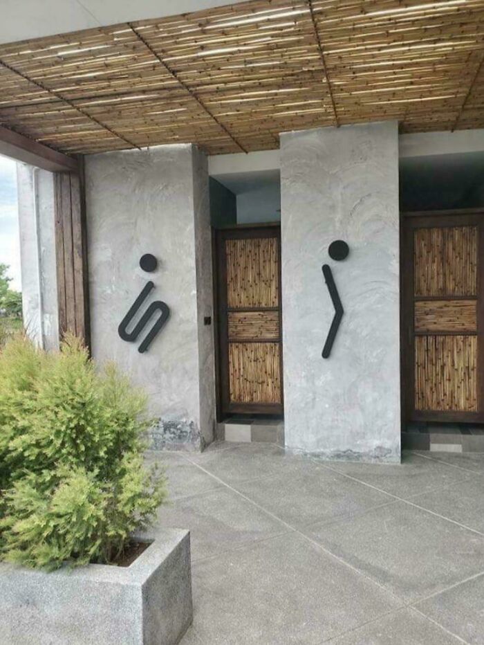 Restroom signs with creative human figures indicating men's and women's bathrooms unique design