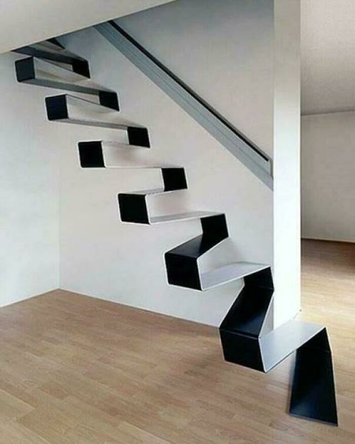 Minimalist black and white zigzag staircase with a sleek modern look