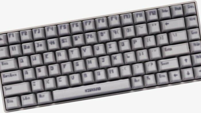 Blurred computer keyboard with unusual design and gray keys