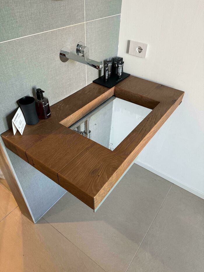 Modern sink design with wood countertop and a rectangular basin