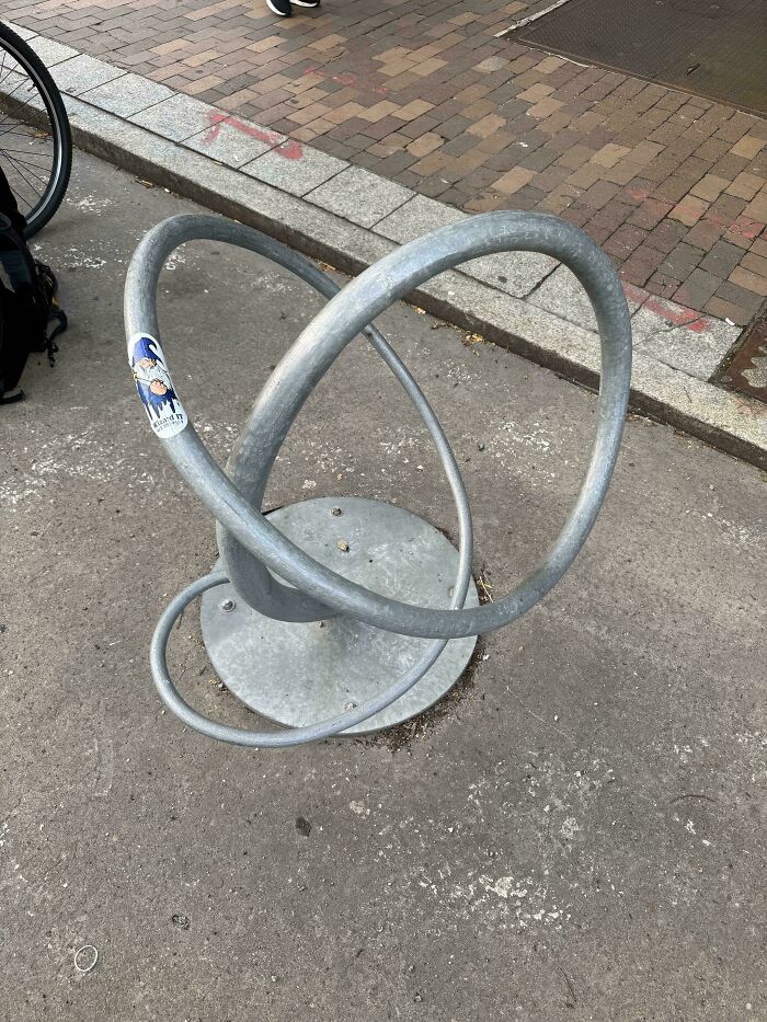 Confusing bike rack made of intertwined metal loops serving as design