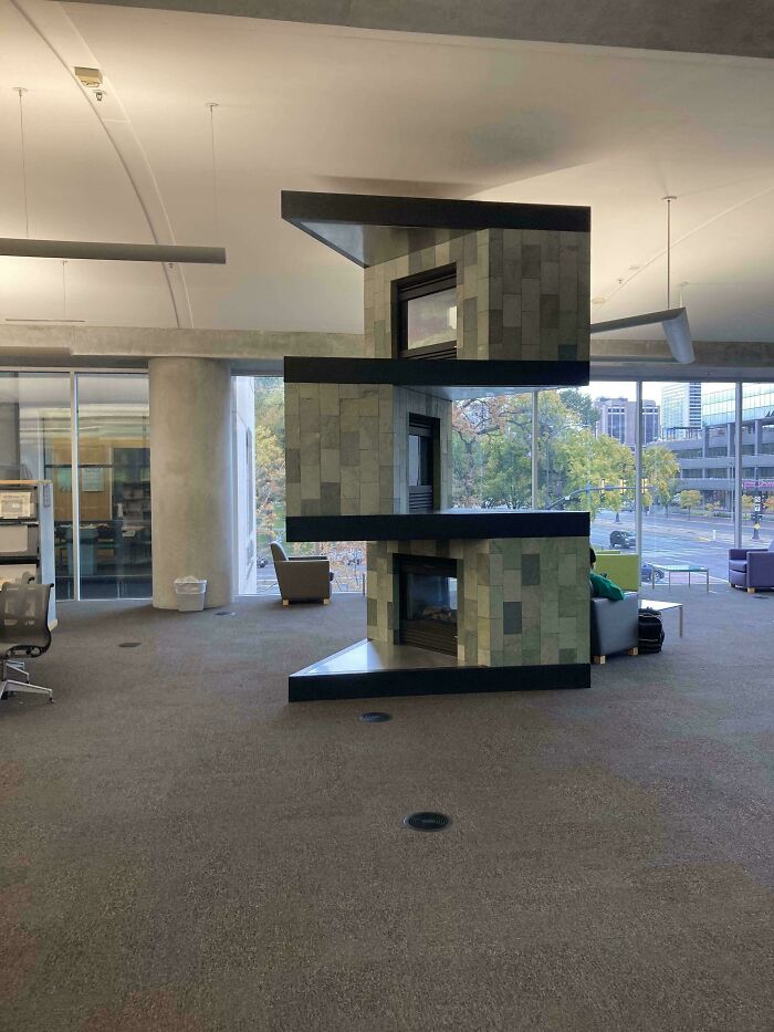 Abstract modern fireplace design in spacious office highlighting design
