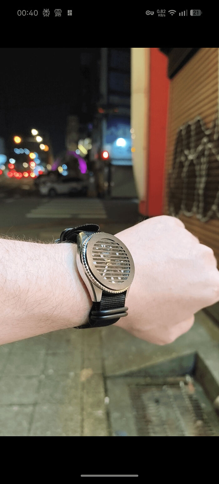 Watch with obstructed face highlighting unusual design choice and minimalism