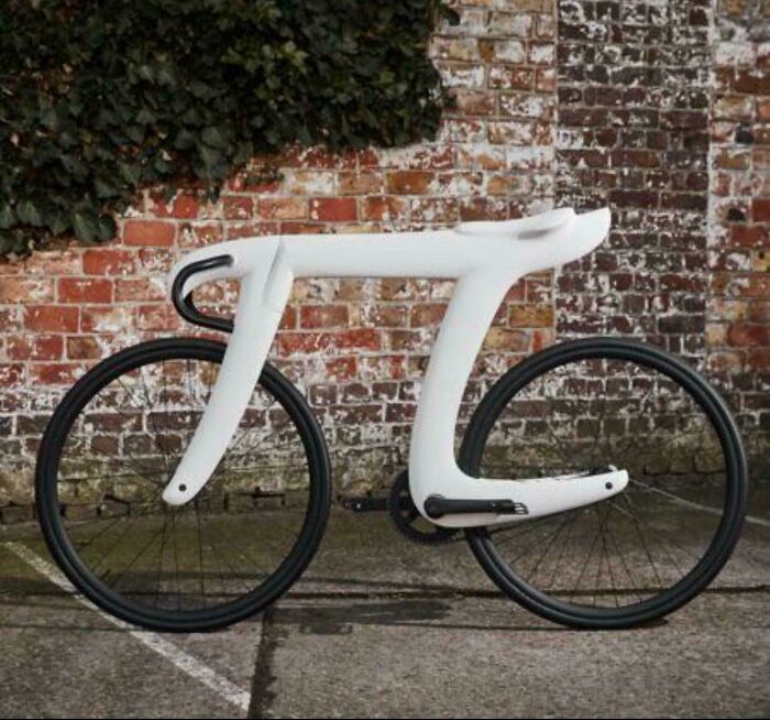 Minimalist futuristic bike design against brick wall showing less is more design concept