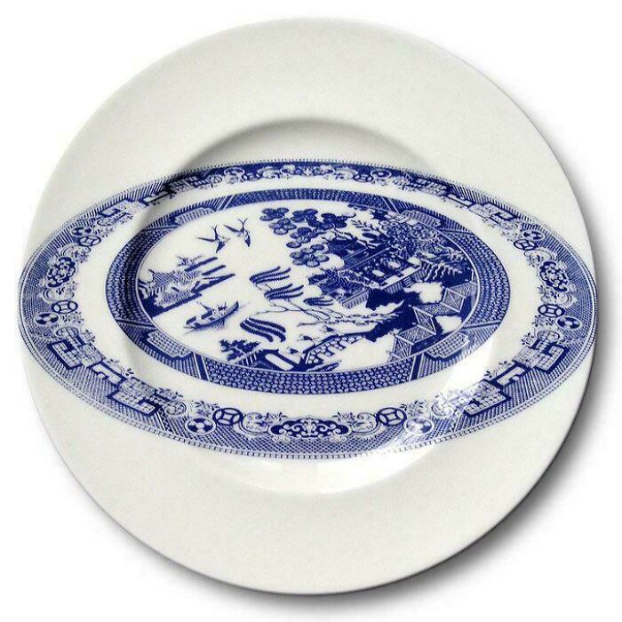 White plate with traditional blue oriental design distorted in the center