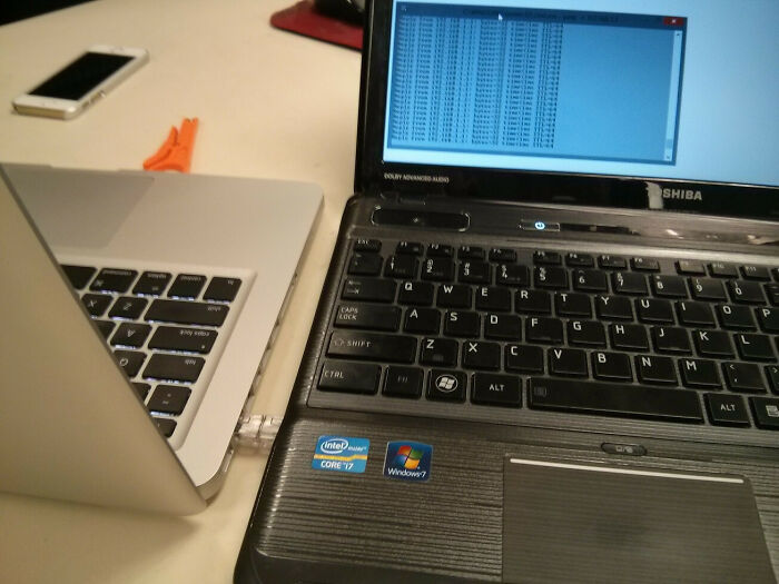 An image showing two laptops connected with an ethernet cable, an example of electronics fails.