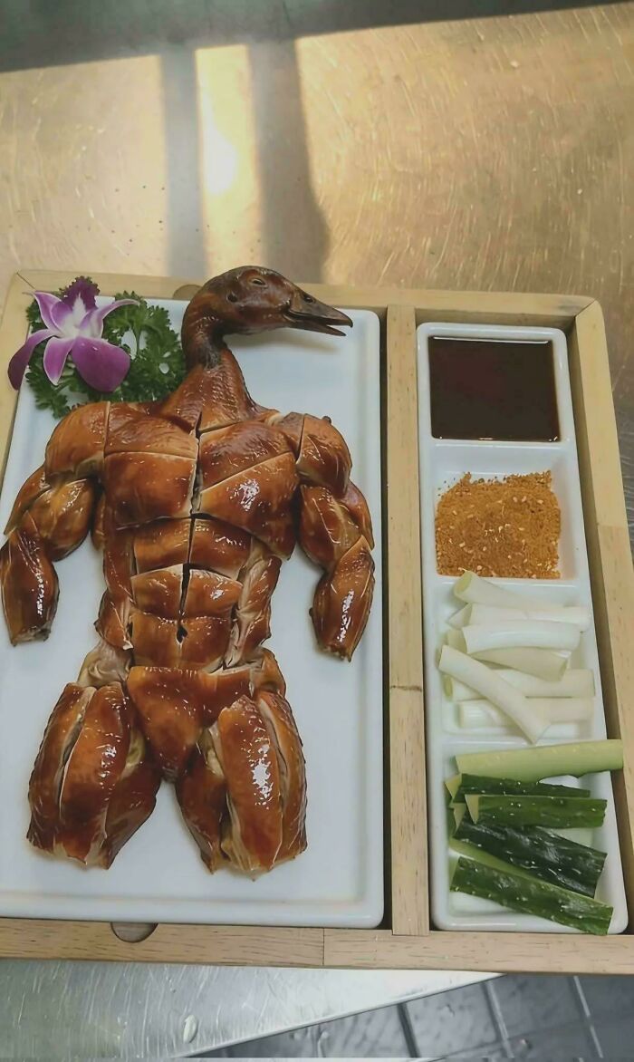 A roasted duck carved into the shape of a muscular body, a miscellaneous post that might entertain you at work.