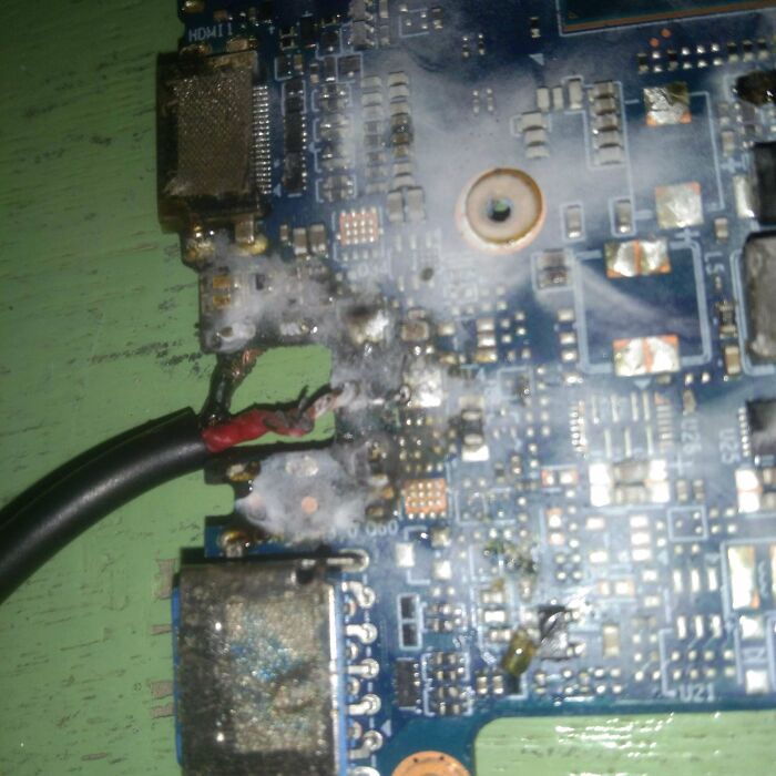 A close-up of a severely damaged and corroded circuit board, one of many electronics fails that IT guys fix.
