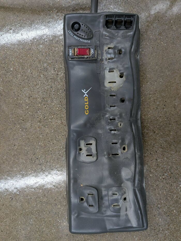 A dangerously melted power strip, a clear example of electronics fails and why IT guys deserve respect.