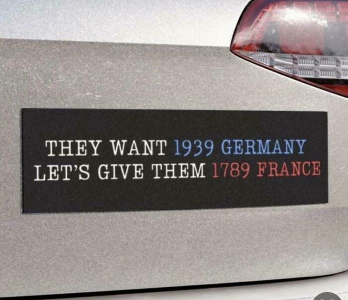Political bumper sticker referencing 1939 Germany and 1789 France on a car